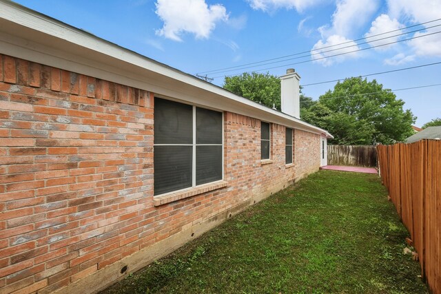 3220 Steamboat Dr, Fort Worth, TX 76123 - view of side of property with brick siding, crawl space, and a chimney