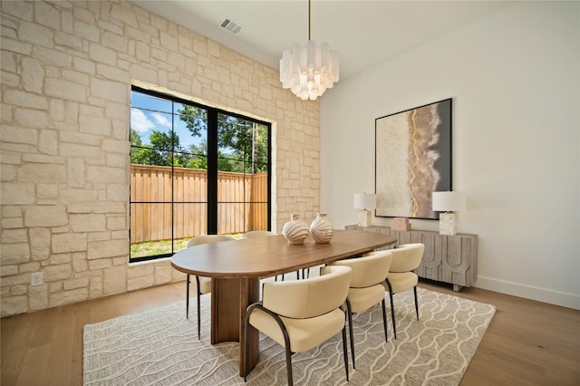 3727 Clover Ln, Dallas, TX 75220 - dining area with wood finished floors and a chandelier