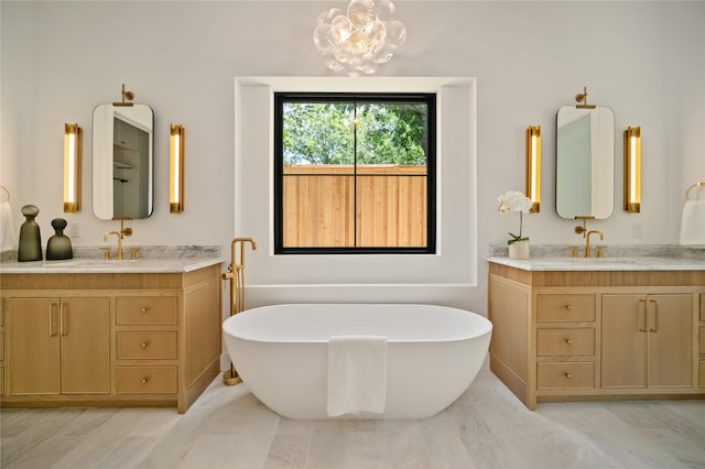 3727 Clover Ln, Dallas, TX 75220 - full bath featuring two vanities, a soaking tub, and a chandelier