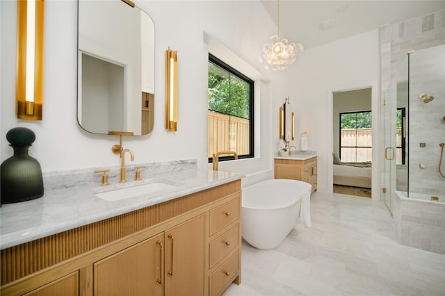 3727 Clover Ln, Dallas, TX 75220 - bathroom with a shower stall, two vanities, a soaking tub, and a chandelier