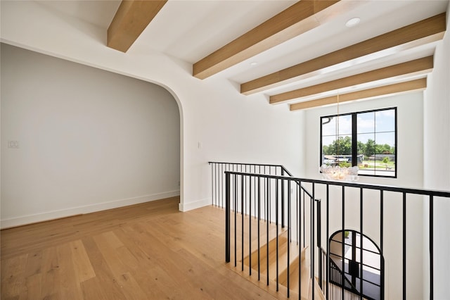 3727 Clover Ln, Dallas, TX 75220 - hallway featuring beam ceiling, wood finished floors, and arched walkways