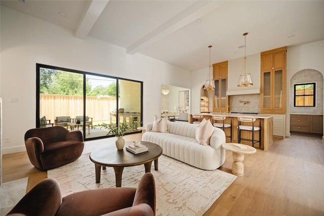 3727 Clover Ln, Dallas, TX 75220 - living area featuring beamed ceiling, light wood-style flooring, and a high ceiling
