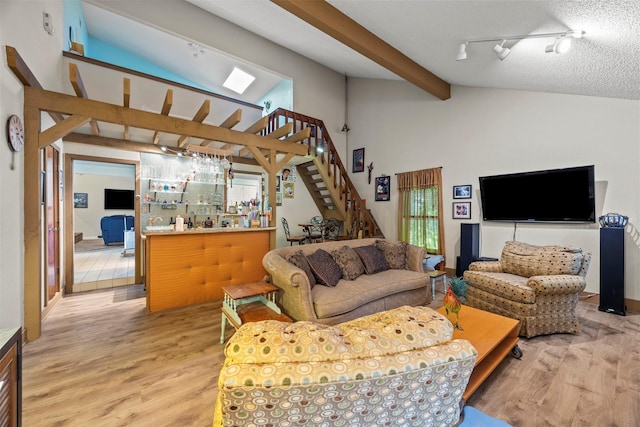 907 Green Terrace Ln, Duncanville, TX 75137 - living area with stairway, light wood-type flooring, and rail lighting