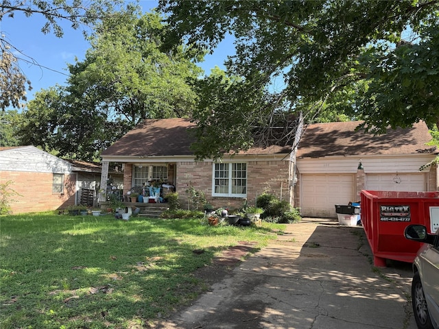 608 W 8th St, Irving, TX 75060 - view of front facade featuring brick siding, an attached garage, a front lawn, and concrete driveway