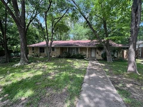5703 Flamingo Ct, Rowlett, TX 75089 - single story home with a front lawn