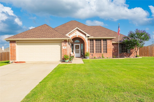 102 Avery Ln, Fate, TX 75189 - view of front facade featuring brick siding, concrete driveway, a garage, and roof with shingles