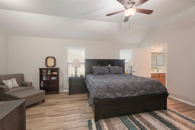 102 Avery Ln, Fate, TX 75189 - bedroom featuring light wood finished floors, multiple windows, vaulted ceiling, baseboards, and connected bathroom