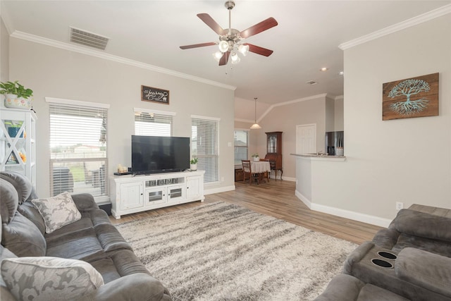 102 Avery Ln, Fate, TX 75189 - living area with baseboards, ceiling fan, light wood-style floors, crown molding, and recessed lighting