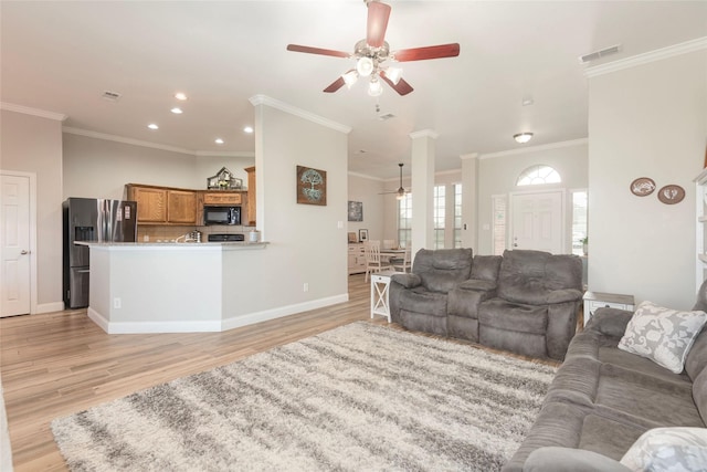 102 Avery Ln, Fate, TX 75189 - living room featuring a ceiling fan, light wood finished floors, ornamental molding, baseboards, and recessed lighting