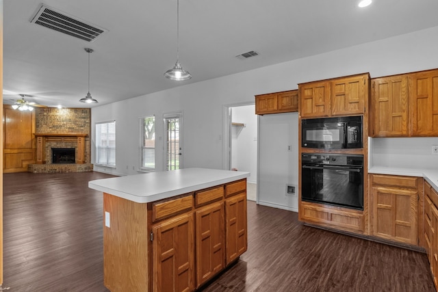 6814 Silver Lake Dr, Rowlett, TX 75089 - kitchen featuring black appliances, ceiling fan, dark wood-style floors, a brick fireplace, and light countertops