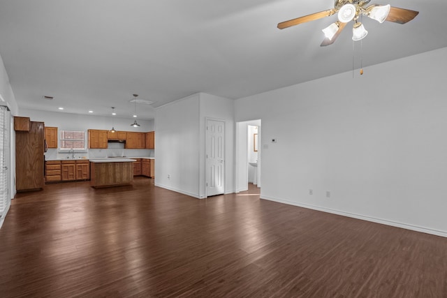 6814 Silver Lake Dr, Rowlett, TX 75089 - unfurnished living room featuring a sink, dark wood finished floors, ceiling fan, baseboards, and recessed lighting