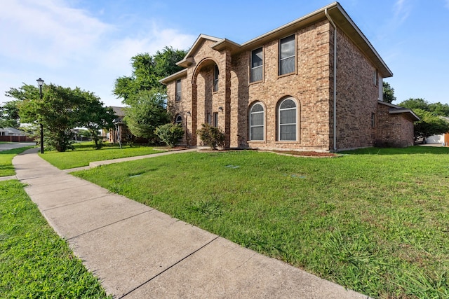 6814 Silver Lake Dr, Rowlett, TX 75089 - view of front of home featuring a front lawn and brick siding