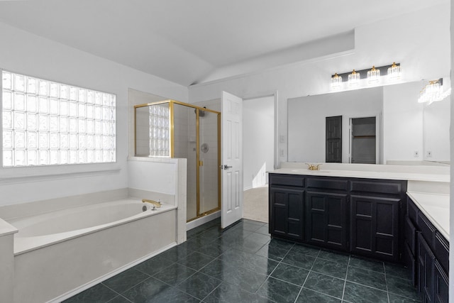 6814 Silver Lake Dr, Rowlett, TX 75089 - full bath with vanity, a garden tub, a shower stall, lofted ceiling, and tile patterned flooring