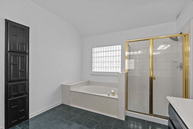 6814 Silver Lake Dr, Rowlett, TX 75089 - full bathroom featuring a bath, a stall shower, vaulted ceiling, tile patterned flooring, and vanity