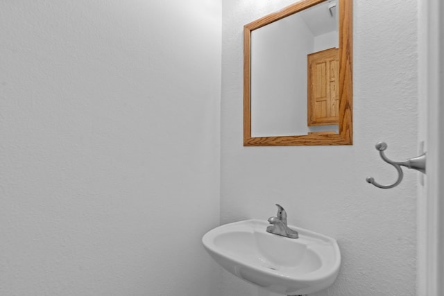 6814 Silver Lake Dr, Rowlett, TX 75089 - bathroom with a sink and a textured wall