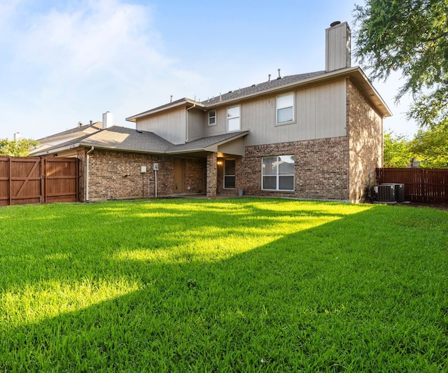 6814 Silver Lake Dr, Rowlett, TX 75089 - rear view of house featuring a chimney, brick siding, cooling unit, and a shingled roof