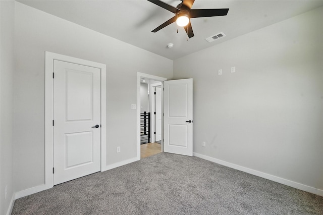 1901 Varsity Dr, Grand Prairie, TX 75051 - unfurnished bedroom with carpet, baseboards, and ceiling fan