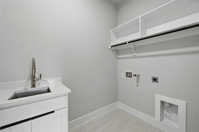 1901 Varsity Dr, Grand Prairie, TX 75051 - washroom featuring electric dryer hookup, hookup for a washing machine, cabinet space, baseboards, and light tile patterned floors