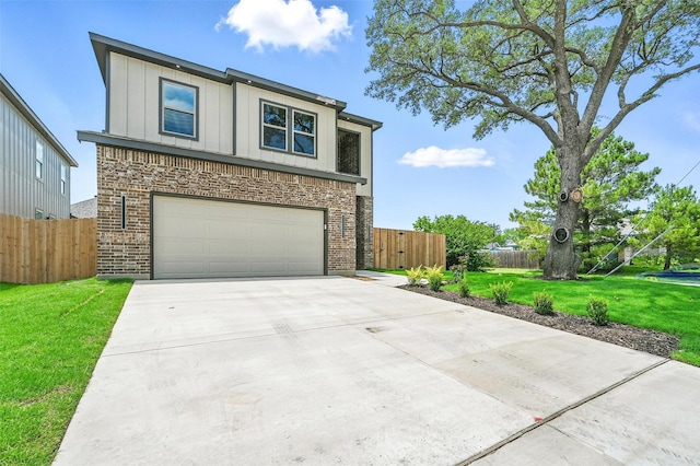 1901 Varsity Dr, Grand Prairie, TX 75051 - view of front facade featuring a garage, driveway, board and batten siding, and brick siding