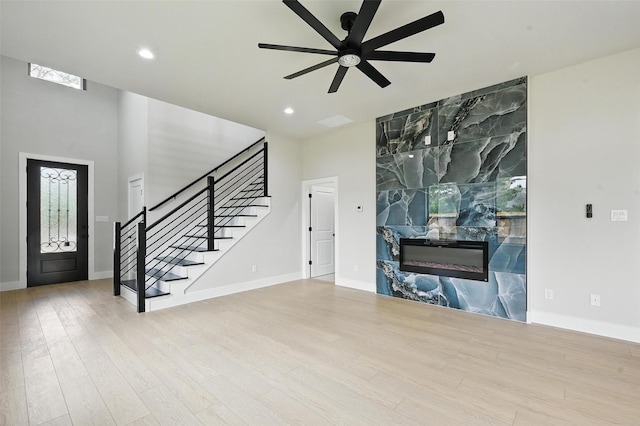1901 Varsity Dr, Grand Prairie, TX 75051 - unfurnished living room featuring a ceiling fan, stairs, wood finished floors, baseboards, and recessed lighting