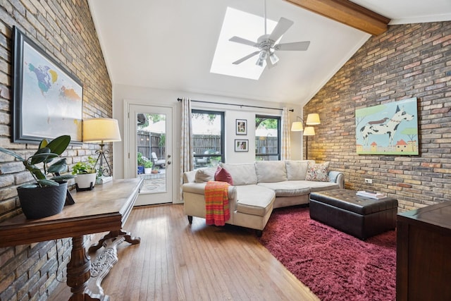 1533 Aylesbury Ln, Plano, TX 75075 - living room with a ceiling fan, hardwood / wood-style floors, a skylight, and brick wall