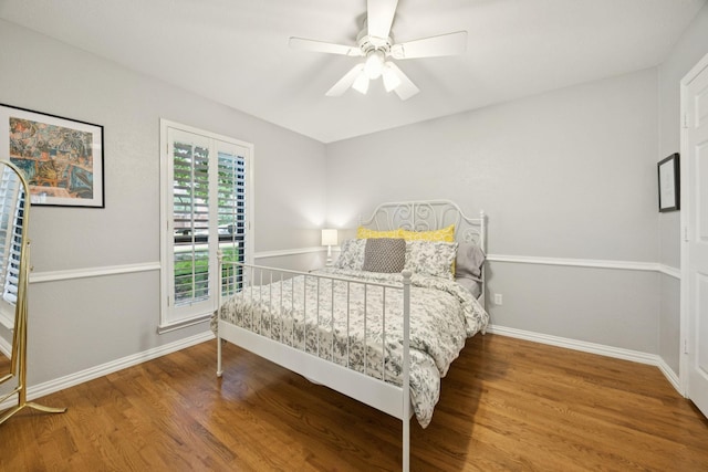 1533 Aylesbury Ln, Plano, TX 75075 - bedroom featuring wood finished floors, baseboards, and ceiling fan