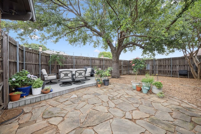 1533 Aylesbury Ln, Plano, TX 75075 - fenced backyard with a patio