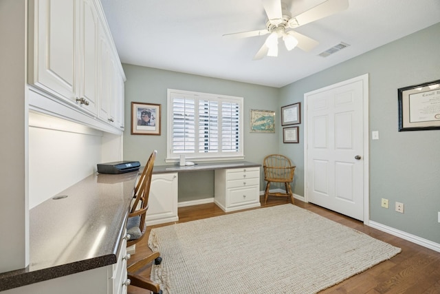 1533 Aylesbury Ln, Plano, TX 75075 - office area with built in study area, dark wood-type flooring, ceiling fan, and baseboards