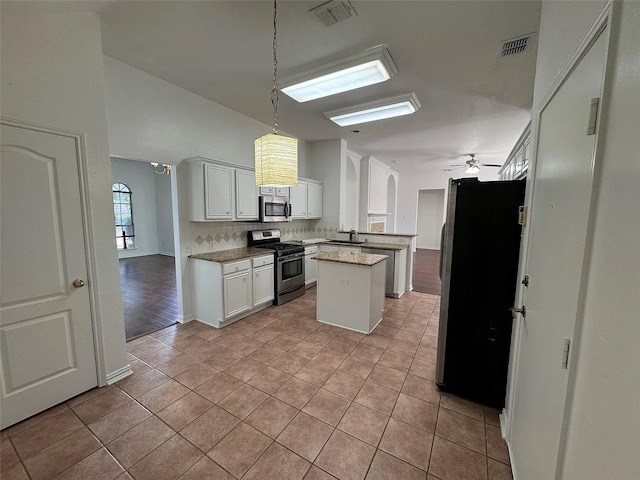 6408 Townsend Ln, Plano, TX 75024 - kitchen with appliances with stainless steel finishes, a sink, decorative backsplash, a ceiling fan, and light tile patterned flooring