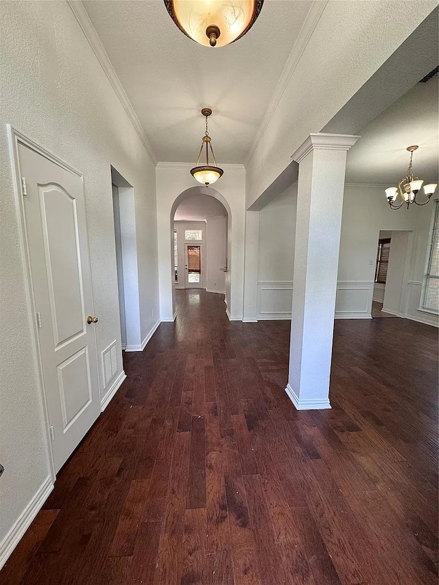 6408 Townsend Ln, Plano, TX 75024 - corridor with crown molding, wood finished floors, arched walkways, and a chandelier