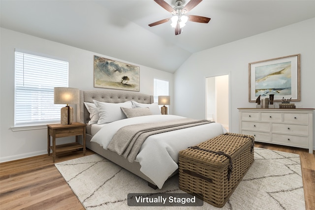 2704 Calmwater Dr, Little Elm, TX 75068 - bedroom with light wood finished floors, baseboards, lofted ceiling, and ceiling fan