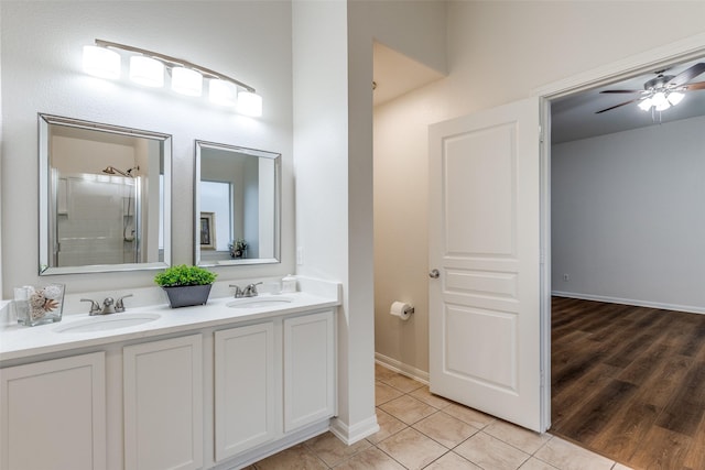 2704 Calmwater Dr, Little Elm, TX 75068 - full bathroom featuring double vanity, tile patterned flooring, ceiling fan, and a shower