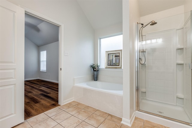 2704 Calmwater Dr, Little Elm, TX 75068 - full bath featuring lofted ceiling, a shower stall, a bath, and tile patterned flooring