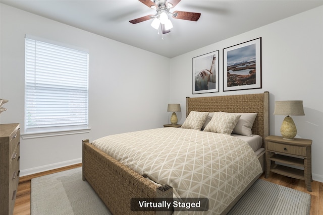 2704 Calmwater Dr, Little Elm, TX 75068 - bedroom with wood finished floors, baseboards, and ceiling fan