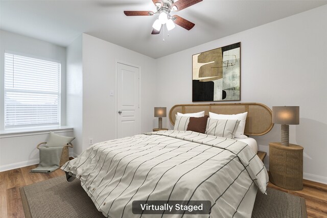 2704 Calmwater Dr, Little Elm, TX 75068 - bedroom with wood finished floors, baseboards, and a ceiling fan