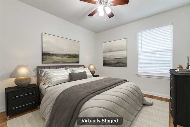 2704 Calmwater Dr, Little Elm, TX 75068 - bedroom with baseboards, wood finished floors, and ceiling fan