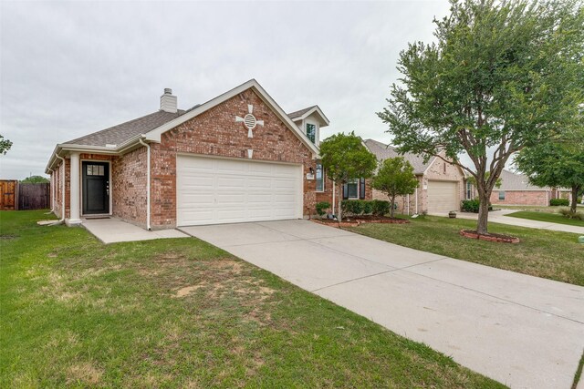 2704 Calmwater Dr, Little Elm, TX 75068 - traditional-style home featuring brick siding, an attached garage, a chimney, concrete driveway, and roof with shingles