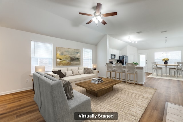 2704 Calmwater Dr, Little Elm, TX 75068 - living room featuring vaulted ceiling, plenty of natural light, ceiling fan, dark wood-style flooring, and baseboards