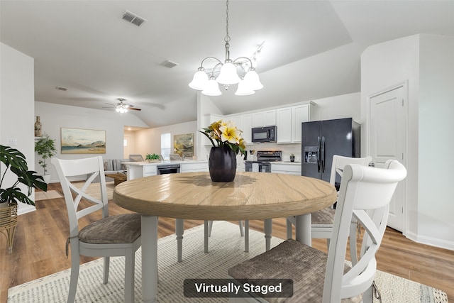 2704 Calmwater Dr, Little Elm, TX 75068 - dining space featuring a chandelier, light wood-style floors, vaulted ceiling, beverage cooler, and a ceiling fan