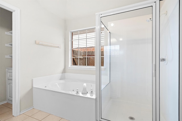 7816 Blossom Dr, Fort Worth, TX 76133 - bathroom with a stall shower, a garden tub, tile patterned flooring, and baseboards