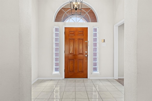 7816 Blossom Dr, Fort Worth, TX 76133 - entrance foyer with baseboards, a chandelier, and light tile patterned flooring