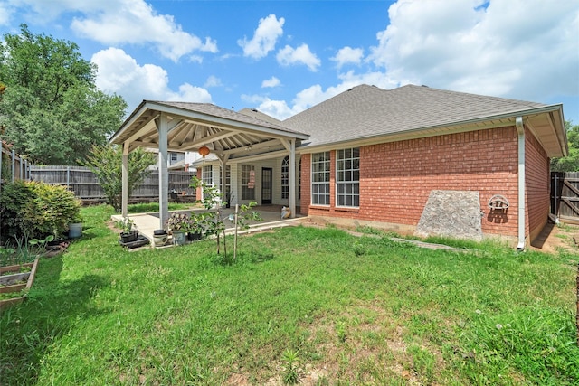 7816 Blossom Dr, Fort Worth, TX 76133 - rear view of property with brick siding, a patio, and roof with shingles