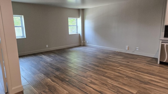 6211 W NW Hwy Unit G224, Dallas, TX 75225 - unfurnished room featuring dark wood-style floors and baseboards