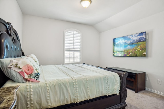 2612 Dancing Flame Dr, Denton, TX 76201 - bedroom featuring light colored carpet, lofted ceiling, and baseboards