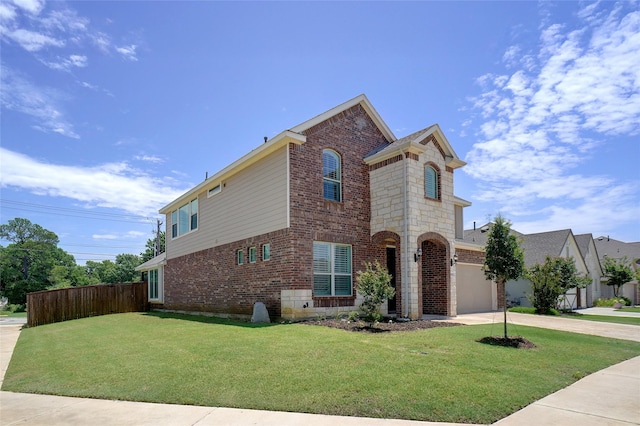 2612 Dancing Flame Dr, Denton, TX 76201 - view of front facade featuring an attached garage, brick siding, and driveway