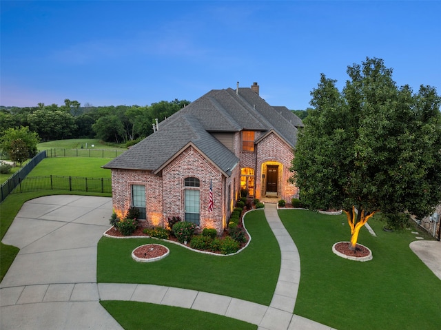 6619 Crestmoor Ln, Sachse, TX 75048 - french country style house with brick siding, roof with shingles, and a chimney