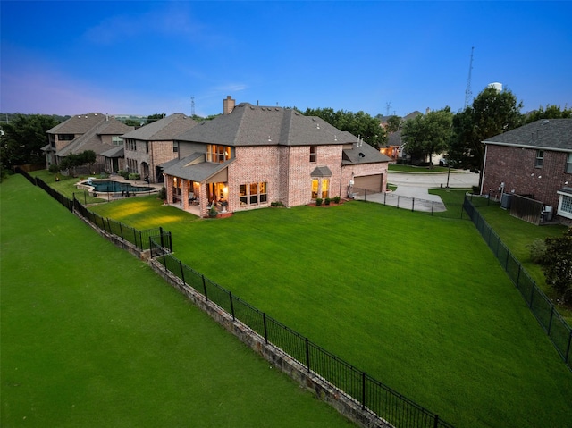 6619 Crestmoor Ln, Sachse, TX 75048 - back of house featuring brick siding, a chimney, a fenced backyard, and driveway