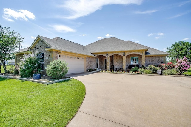 112 Tigers Eye Ct, Weatherford, TX 76087 - view of front of house with a garage, concrete driveway, a front yard, covered porch, and a shingled roof