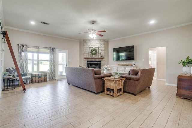 112 Tigers Eye Ct, Weatherford, TX 76087 - living area featuring a ceiling fan, a fireplace, light wood-style floors, ornamental molding, and baseboards