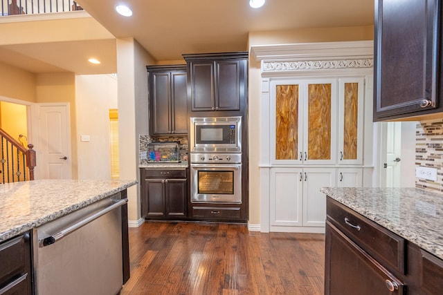 3548 Tuscan Hills Cir, Denton, TX 76210 - kitchen featuring stainless steel appliances, backsplash, dark brown cabinetry, dark wood-type flooring, and recessed lighting